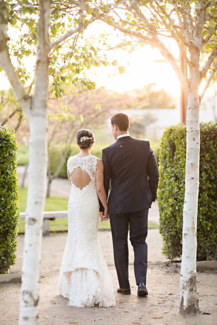 bride and groom standing in birch garden
